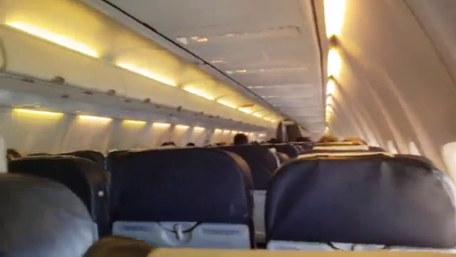 Blondie giving a blowjob to a stranger on an airplane