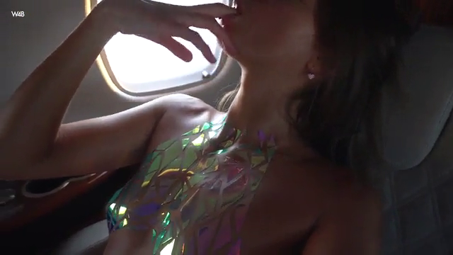 Goddess brunette finguering herself on a private plane