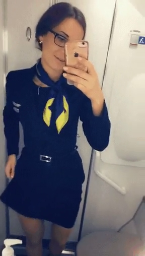 Hot flight attendant masturbating on the airplane toilet