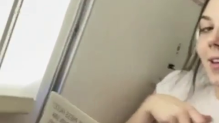 nerdy chick spreads her cheeks on te plane bathroom